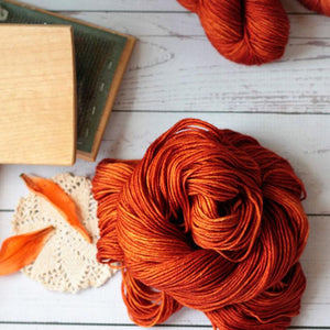 hand dyed yarn in copper orange, merino wool, nylon, bamboo, 4 oz skein, handmade in the US by Yarn Love